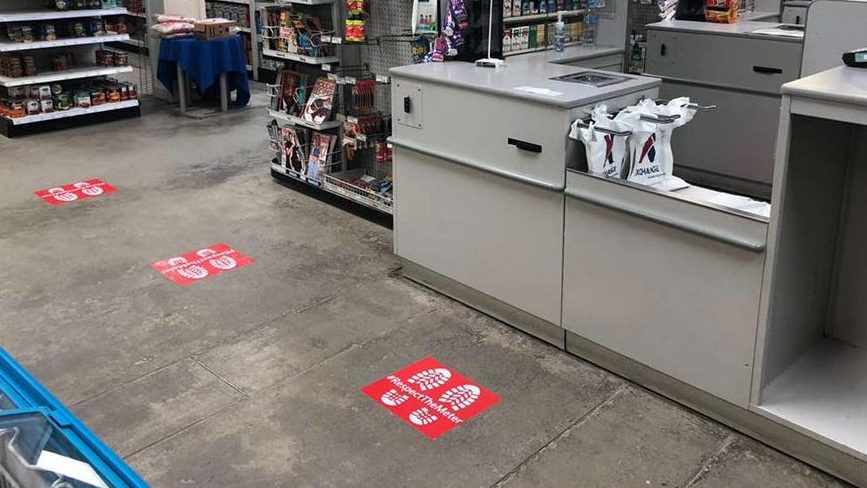 Footprints at the Camp Bondsteel Exchange in,Kosovo remind customers to stay 6 feet away from each other.