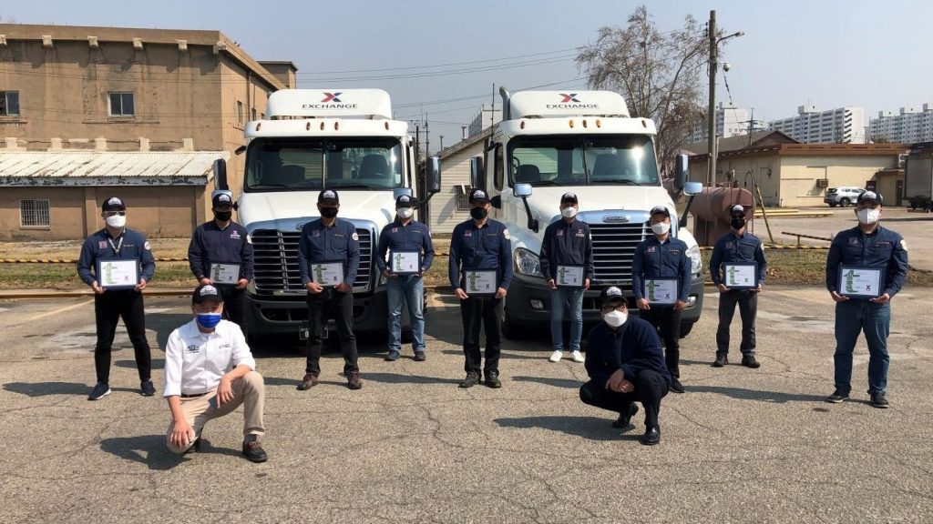 Pacific Region drivers at Camp Market In Korea show awards presented by managers for exceptional work during trying times.