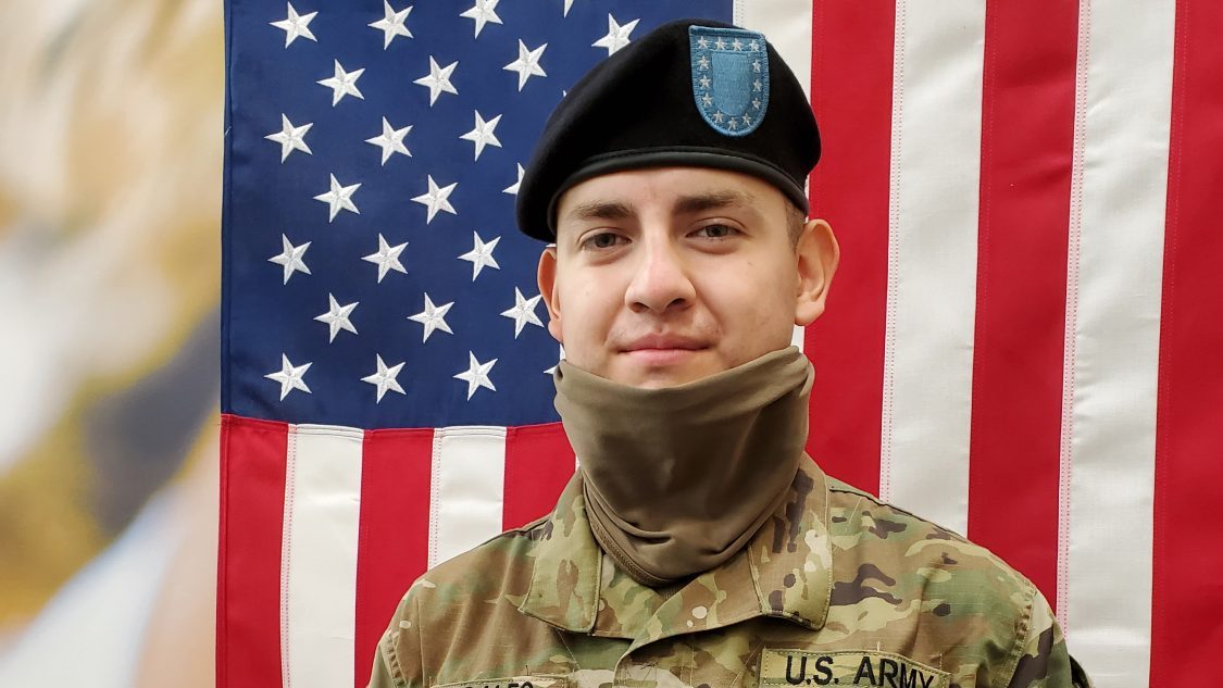 Pvt. Urian Morales poses with the Exchange gift card his mother, Patricia, bought for him through My Fort Jackson Soldier.