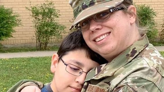 MD's Carrie Villa hugs her son, Santiago, before departing for New York City to help care for COVID-19 patients.