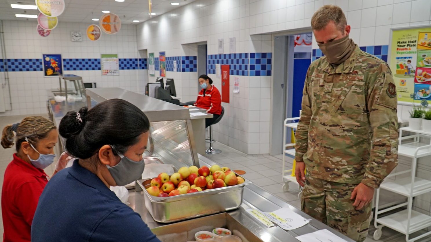 Exchange School Meal Program Food Server Emily Turner (left) and SMP Supervisor Ana Marie Kral, prepare a grab-and-go meal June 4, 2020 at Ramstein Intermediate School. (U.S. Army photo by Sgt. 1st Class Taresha Hill)