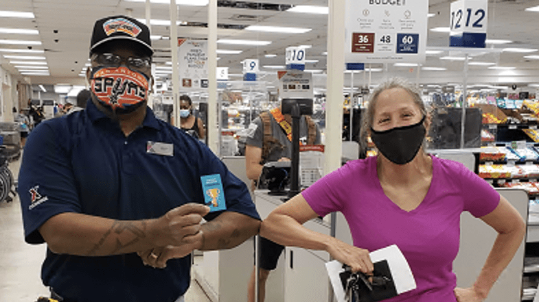 Winford Smith, loss prevention associate at JB San Antonio-Fort Sam Houston, helps a customer at the main store.