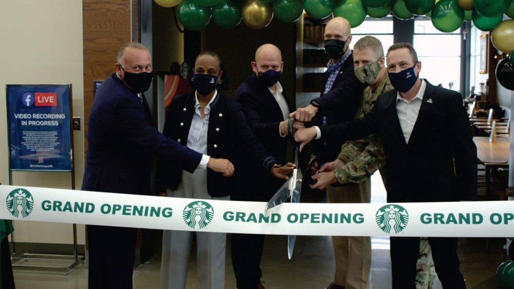 Army & Air Force Exchange Service and Starbucks officials cut the ribbon on the Exchange’s 100th Starbucks retail licensed location Sept. 17 at Joint Base Lewis-McChord. From left, Ronny Rexrode, Vice President, Food and Theater Operations, Exchange; Shelly Armstrong, Western Region Senior Vice President, Exchange; Aaron Koransky, Vice President, Licensed Store Business Development, Operations & Strategy, Starbucks; Matt Kress, Senior Manager, Global Responsibility, Starbucks, Col. Skye Duncan, JBLM Garrison Commander; and Mike Einer, JBLM Exchange General Manager.