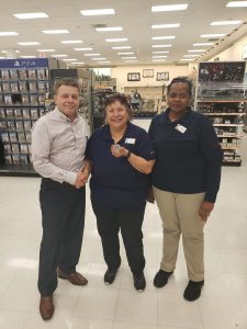 COO Dave Nelson presents a Davis-Monthan AFB associate with a coin