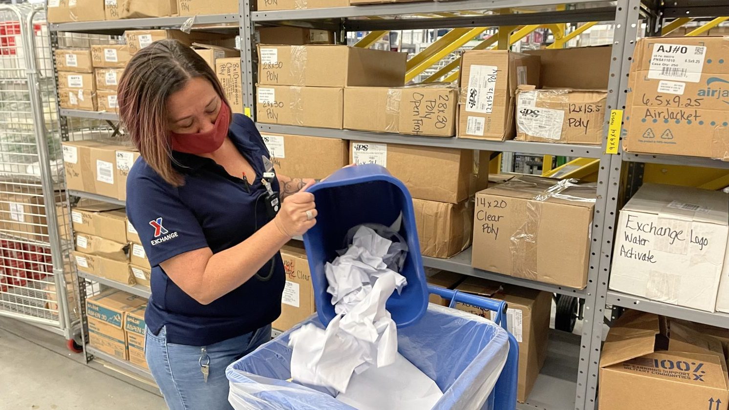 E-Commerce Supervisor Crystal Dillard recycles paper from her office at the Fort Hood Exchange.