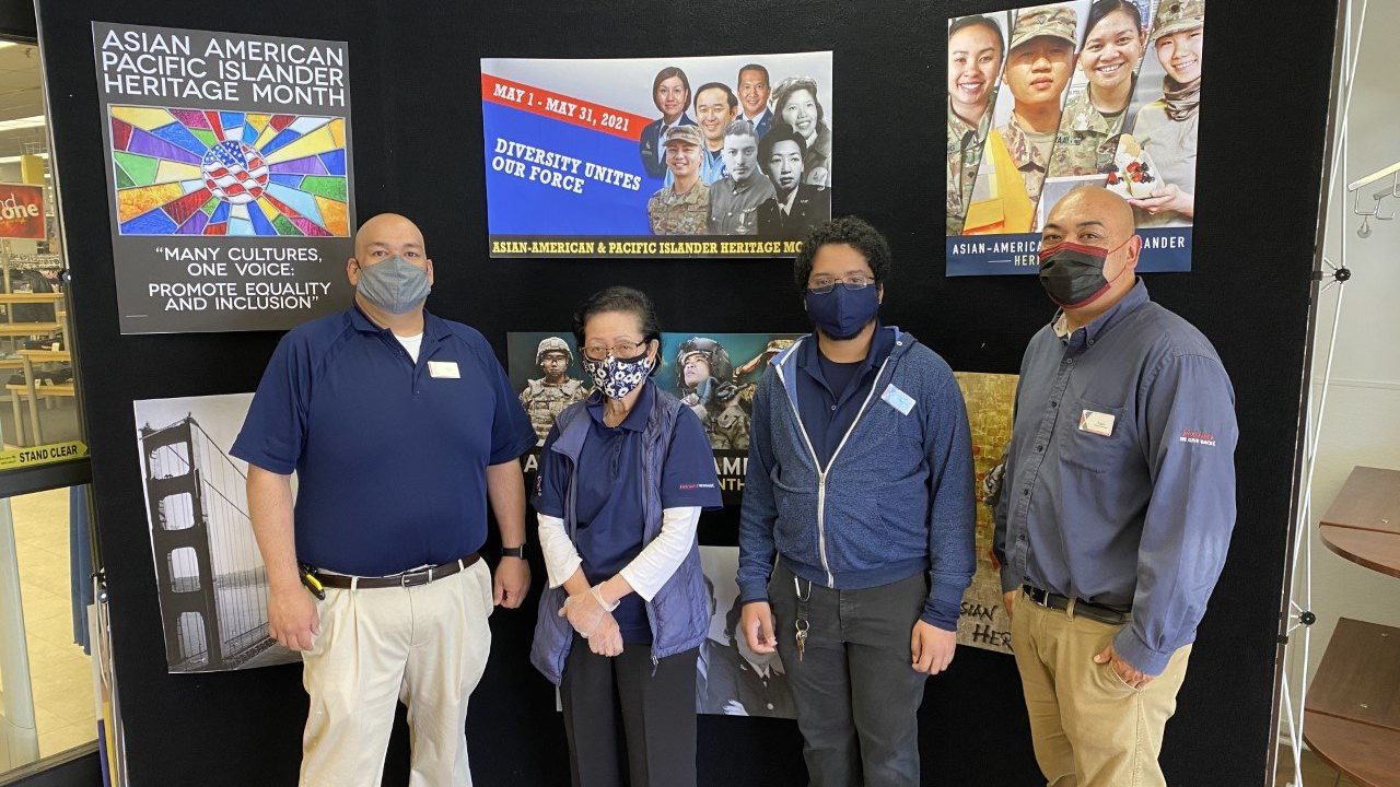 Softlines Manager Frank Cruz, Jr. (right) is one of six members of his family who have served those who serve at the Presidio of Monterey Exchange. Also pictured from left, softlines associates David White, Lilia Fuentebella and Mauricio Martin.