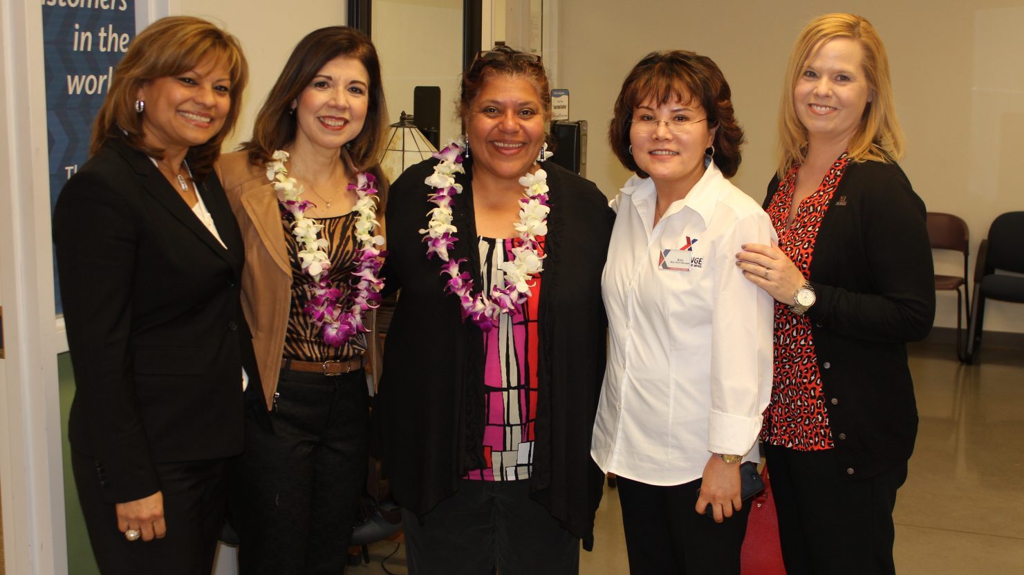 Then-Senior Vice President of the Sales Directorate Ana Middleton joins Senior Vice President of Services and Food Trini Saucedo for a photo with the Fort Belvoir Exchange team in 2014. From left, General Manager Nildy Carrasco-Eiley, Saucedo, Middleton, Main Store Manager Ann Yi and Services Business Manager Veronica Reese.