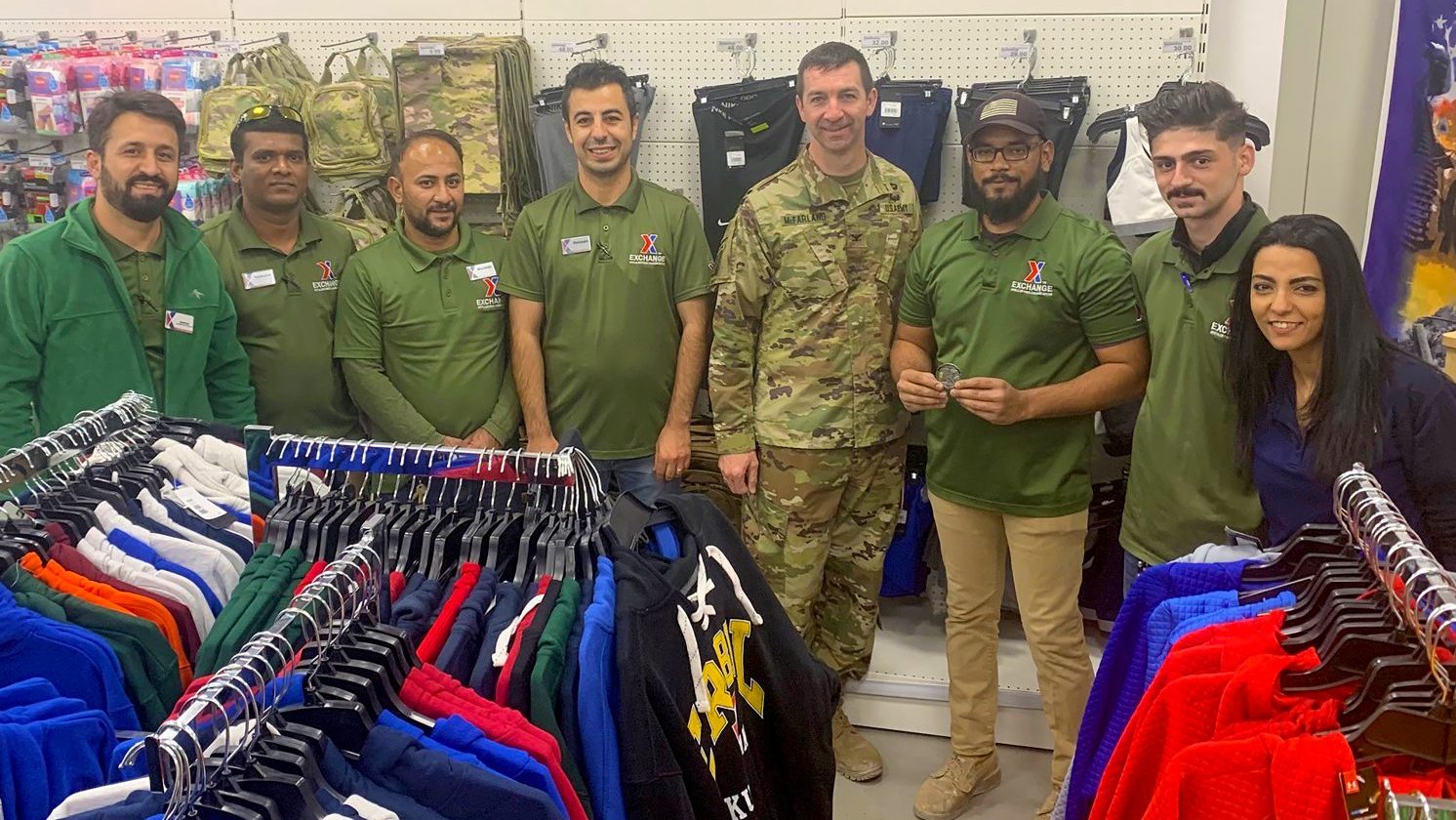 <strong>Col. Scott McFarland stands with the Exchange team in Erbil, Iraq, in August 2019, after recognizing Mohammed Nimroz for his hard work. While visiting Exchange stores across Europe and Southwest Asia, McFarland takes every opportunity to recognize associates who go above and beyond to help military service members.</strong>