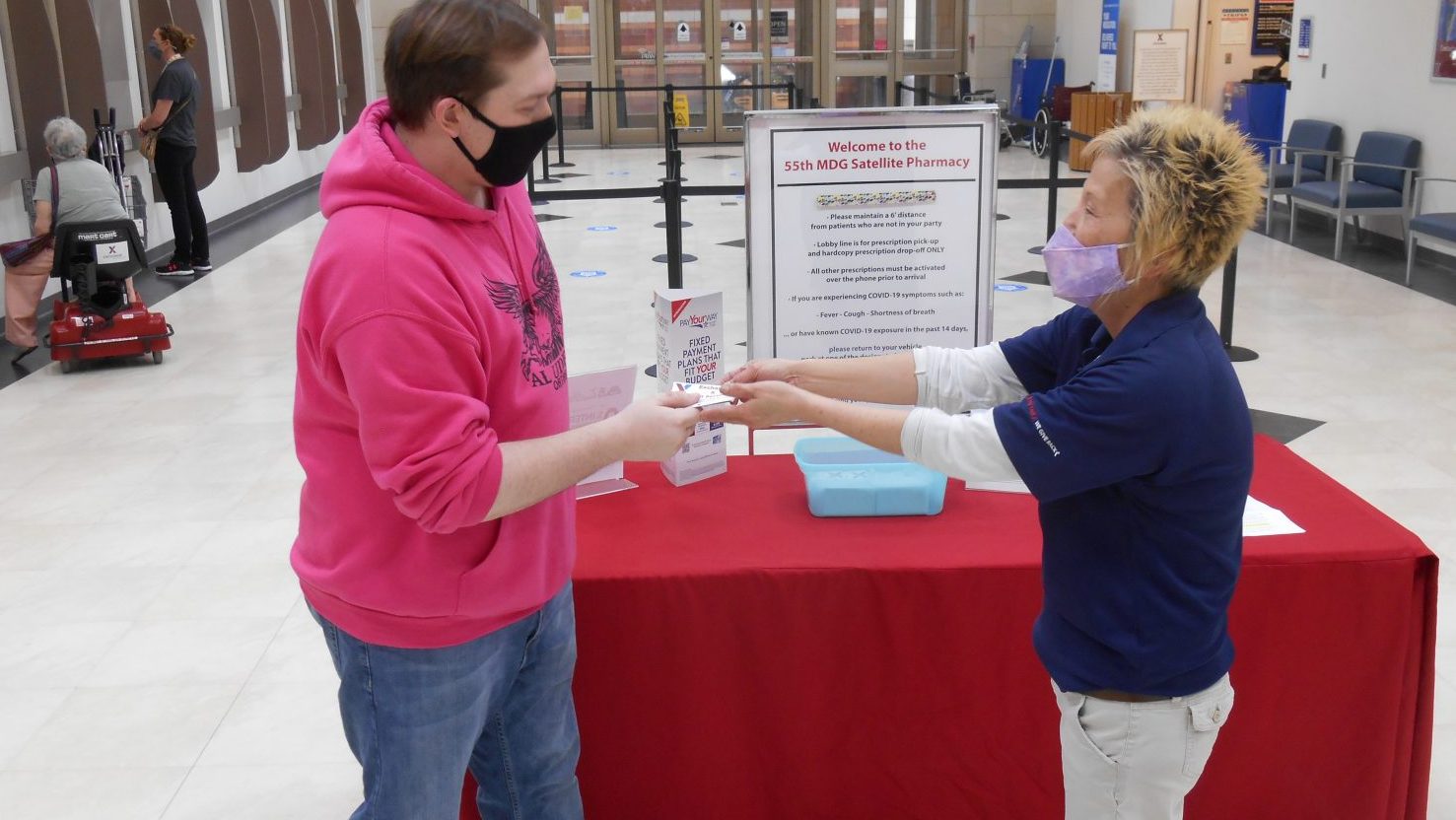 Sally Green assists shopper Zackery Price at the Offutt AFB Exchange