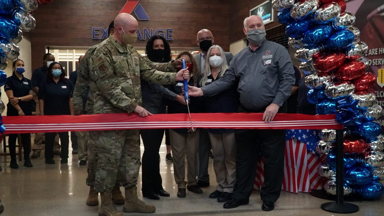 17th Training Wing Commander Col. Matthew R. Reilman (second from left) helps Army & Air Force Exchange Service officials cut the ribbon on a newly renovated Goodfellow Air Force Base Exchange shopping center Aug. 5. Also pictured from left, Exchange Senior Enlisted Advisor Air Force Chief Master Sgt. Kevin Osby, Goodfellow AFB Exchange General Manager Bettina Ciciriello-Frederick, Military Clothing Store Manager Martha Scarlett, Exchange Chief Operating Officer Jason Rosenberg, Goodfellow AFB Exchange Main Store Manager Lisa Piper and Exchange Southwest Region Vice President Wayne Hansen.