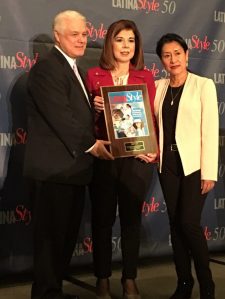 Services and Food Senior Vice President Trini Saucedo accepts a plaque naming the Exchange one of the 50 best companies for Latinas to work at the 2017 Latina Style Top 50 Companies Seminar.