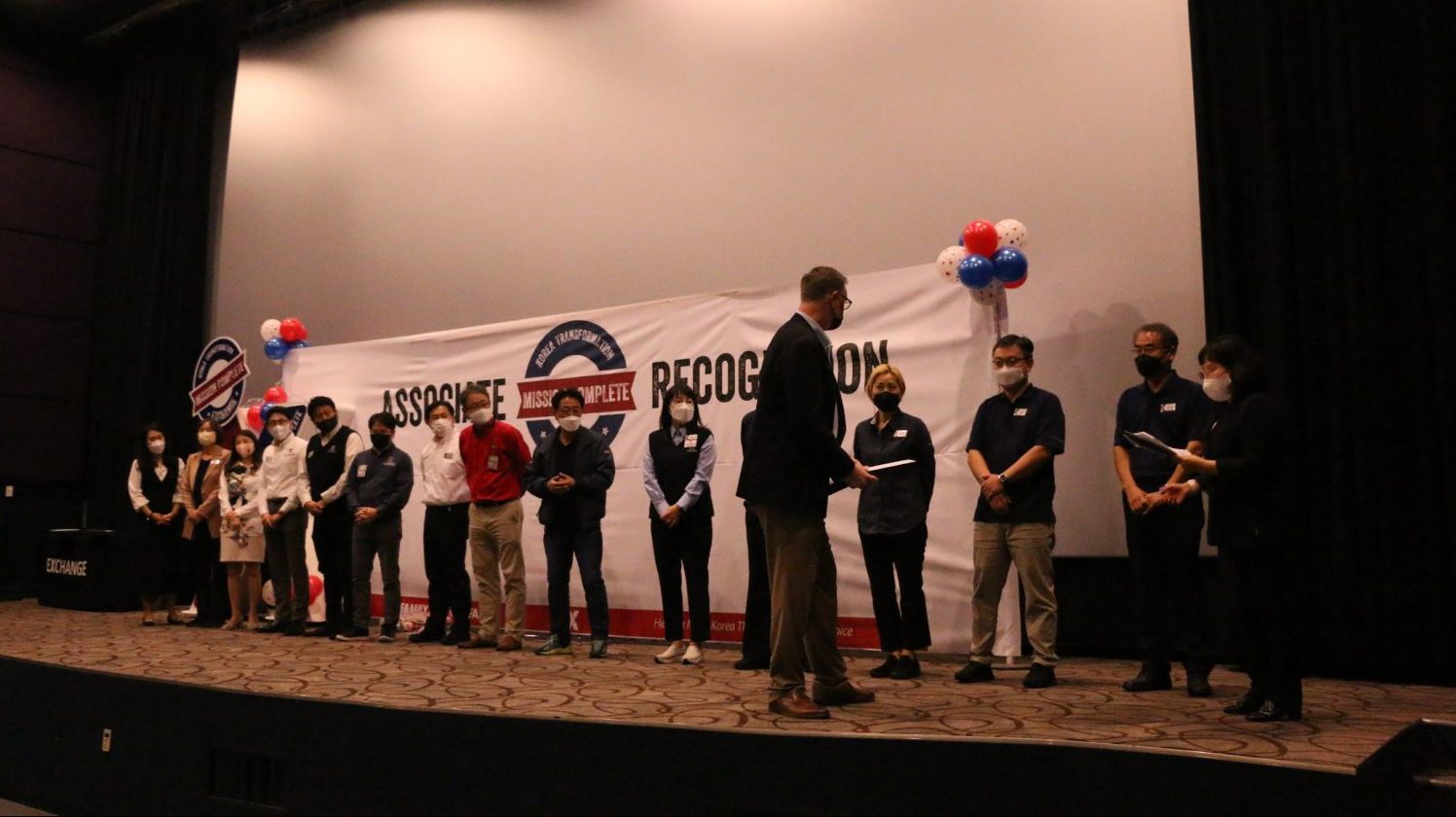 <strong>Pacific Regional Vice President Scott Bonner hands out certificates honoring Korea associates for their role in the Korea Exchange Transformation during a Nov. 4 award ceremony at the U.S. Army Garrison Humphreys theater.</strong>