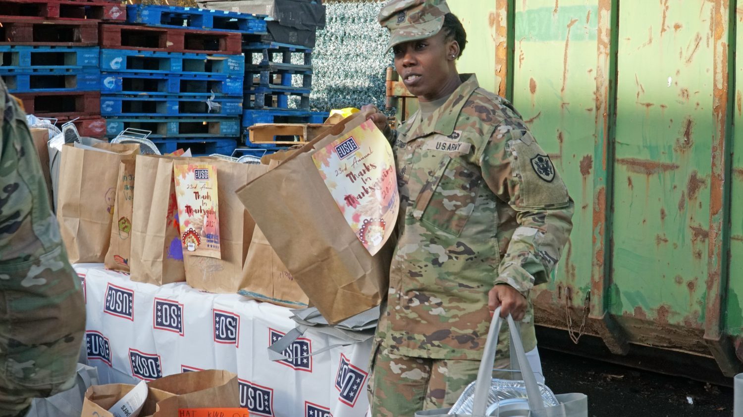 Exchange Europe/Southwest Asia/Africa Region Senior Enlisted Advisor Sgt. Maj. Lemakius Gardner helps other senior enlisted leaders load prepacked bags filled with Thanksgiving items Nov. 20 during United Service Organizations’ annual Thanks for Thanksgiving event at Vogelweh Military Complex, Germany.