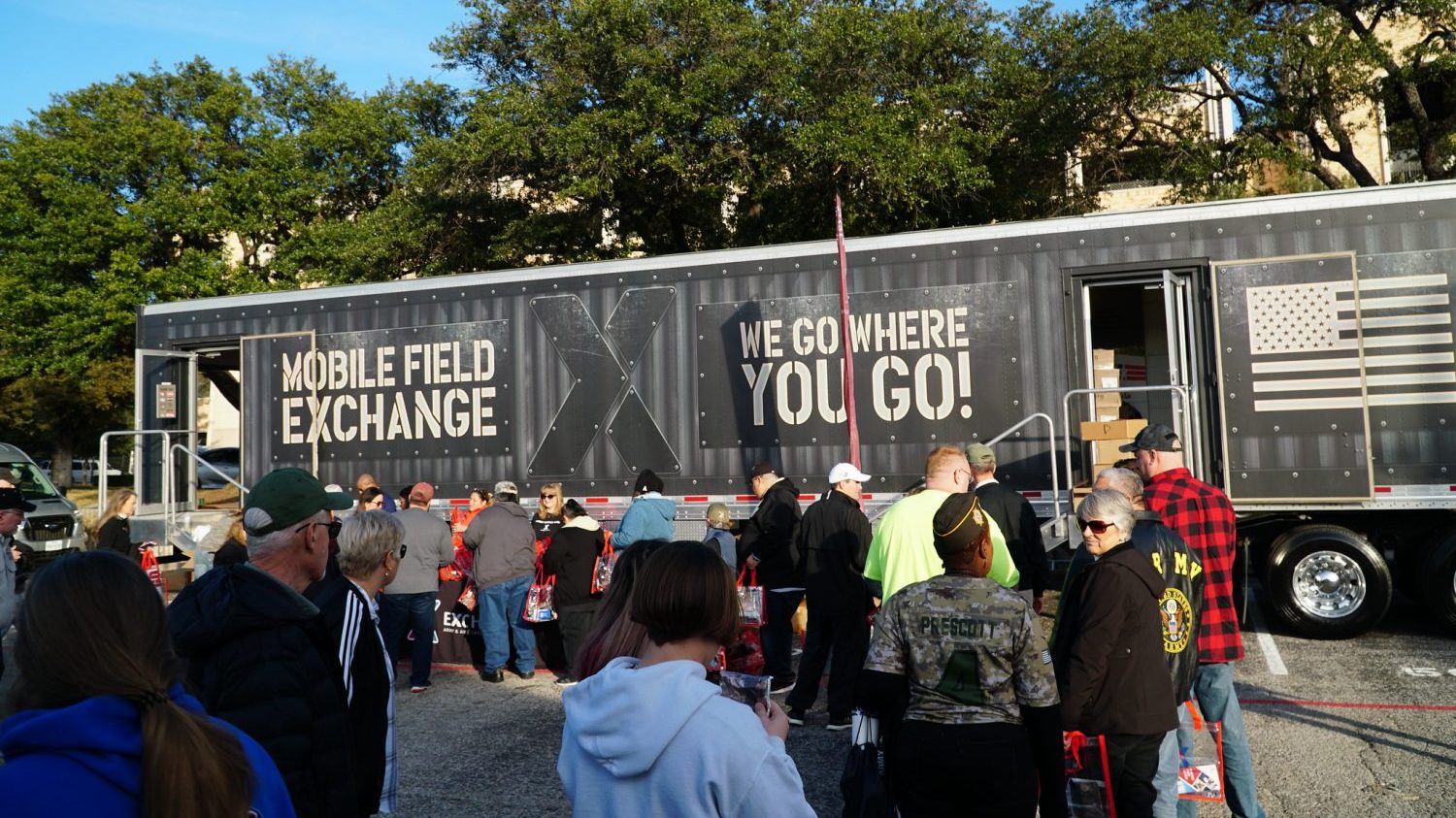 <strong>The Exchange Corporate Communication team greeted fans from a mobile field Exchange staged outside Amon G. Carter Stadium at Texas Christian University in Fort Worth for the Armed Forces Bowl.</strong>