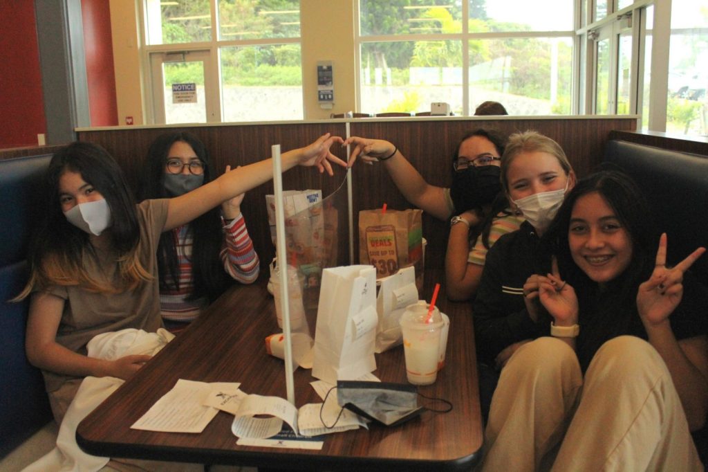 <strong>On Nov. 23 and 24, Ryukyu Middle-School students pose for a picture after successfully ordered their lunch in Japanese at Kadena Fairchild’s Burger King. Due to the current COVID-19 pandemic, Ryukyu Middle School teachers, Yumi Hasegawa Freeman, Japanese language and Heidi Shimogi, Japanese culture, had to think outside the box to help students find a way to implement their new knowledge and with the help from Kadena Fairchild’s Food Outlet Manager Keita Matsukawa and his Burger King Staff, nearly 180 students ordered their lunch, ate and got back to school in time for their next class. (Photo by Yumi Hasegawa Freeman)</strong>