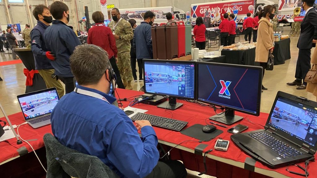 <strong>IT Field Technical Supervisor Shane Hensley prepares a bank of computers to help him and his team manage six live video and audio feeds during the grand opening of the Korea Distribution Center and bakery’s Nov. 19 at U.S. Army Garrison Humphreys</strong>