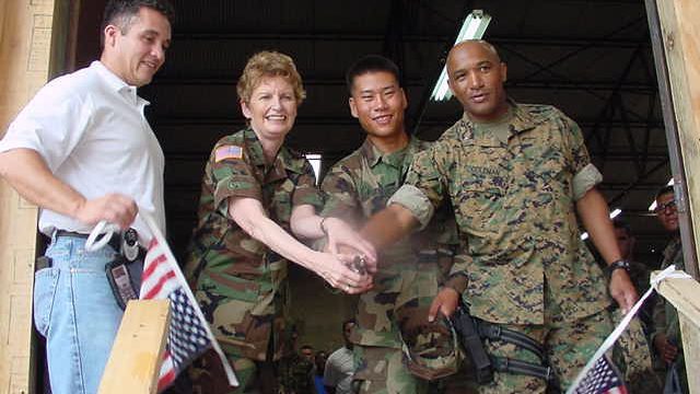 <strong>In this 2004 photo, Maj. Gen. Kathryn Frost is shown helping open a mobile field exchange in Haiti during her tenure as Exchange commander.</strong>