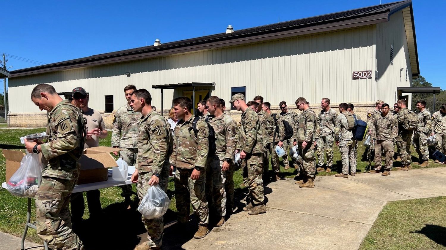 <strong>Best Ranger Competition participants line up to receive giveaway bags from the Exchange.</strong>