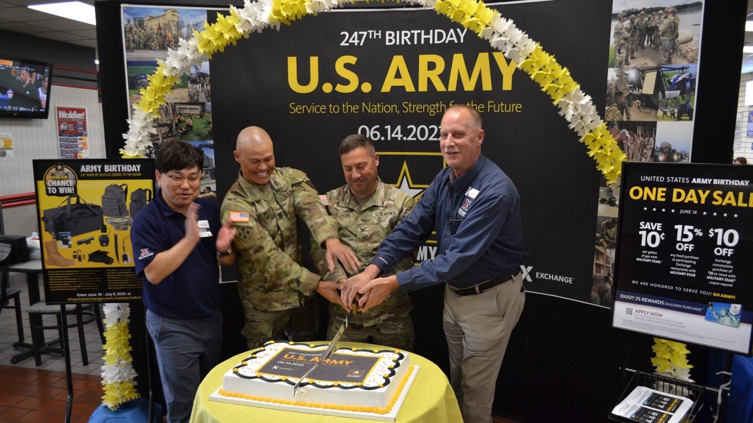 <b>From left: Korea Southern Exchange Store Manager Chinman Chong, U.S. Army Garrison Daegu Command Sgt. Maj. Jonathon J. Blue, Garrison Commander Col. Brian P. Schoellhorn and General Manager Bill Ripley cut the cake for the store's 247th Army birthday celebration.</b>