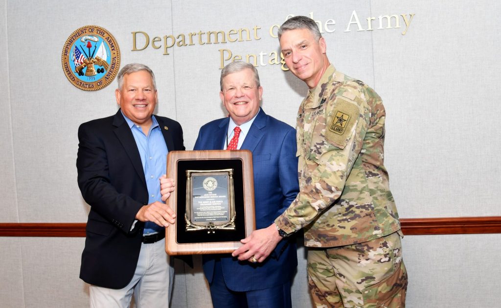 From left, Army Emergency Relief director retired Lt. Gen. Raymond Mason, Exchange Director/CEO Tom Shull, and Vice Chief of Staff of the U.S. Army  Gen. Joseph Martin with the AER's 2022 Jack Ritchie Distinguished Service Award. The award was presented to the Exchange for its work in championing the AER mission of providing financial assistance to Soldiers and their families.