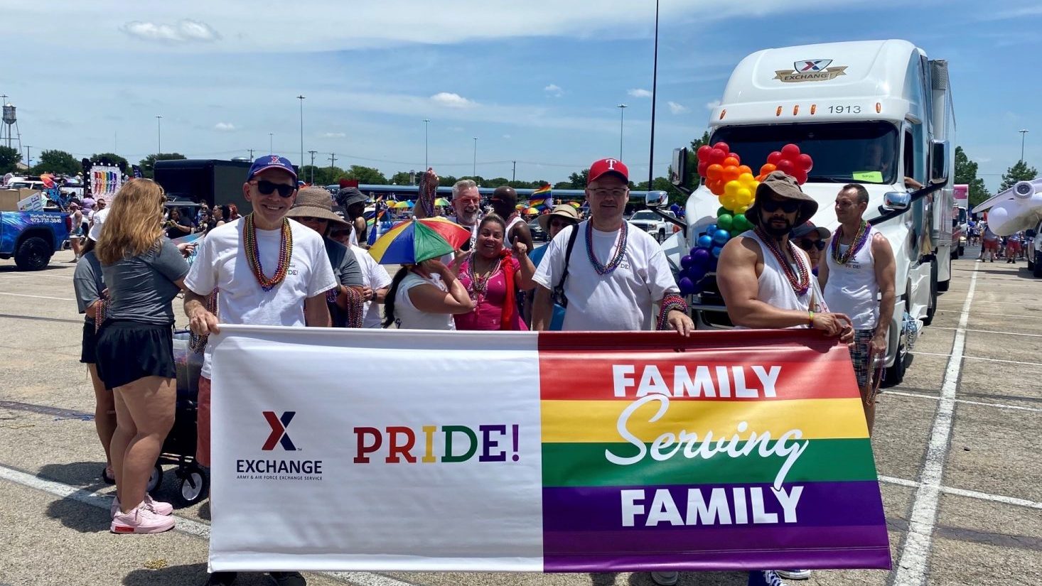 <b>From left, Senior Marketing Manager Scott Lohmann, Chief Operating Officer Jason Rosenberg and Audit Project Manager Roger Hugh with the Exchange PRIDE banner at the Alan Ross Texas Freedom Parade. Lohmann and Hugh are PRIDE's program managers.