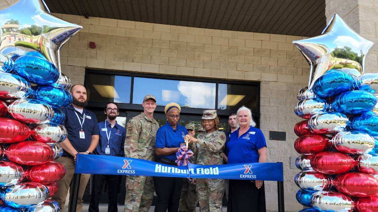 <b>From left, Hurlburt Field Express Shift Manager Adam Roggenkamp, Express Shift Manager James Culver, 1st Special Operations Mission Support Group Commander Col. Dustin Richards, Express Facility Manager Larissa Odom, Senior Airman Vivian Abram and Exchange General Manager Sheila Clark cut the ribbon on the upgradedd Hurlburt Field Express on July 22.</b>