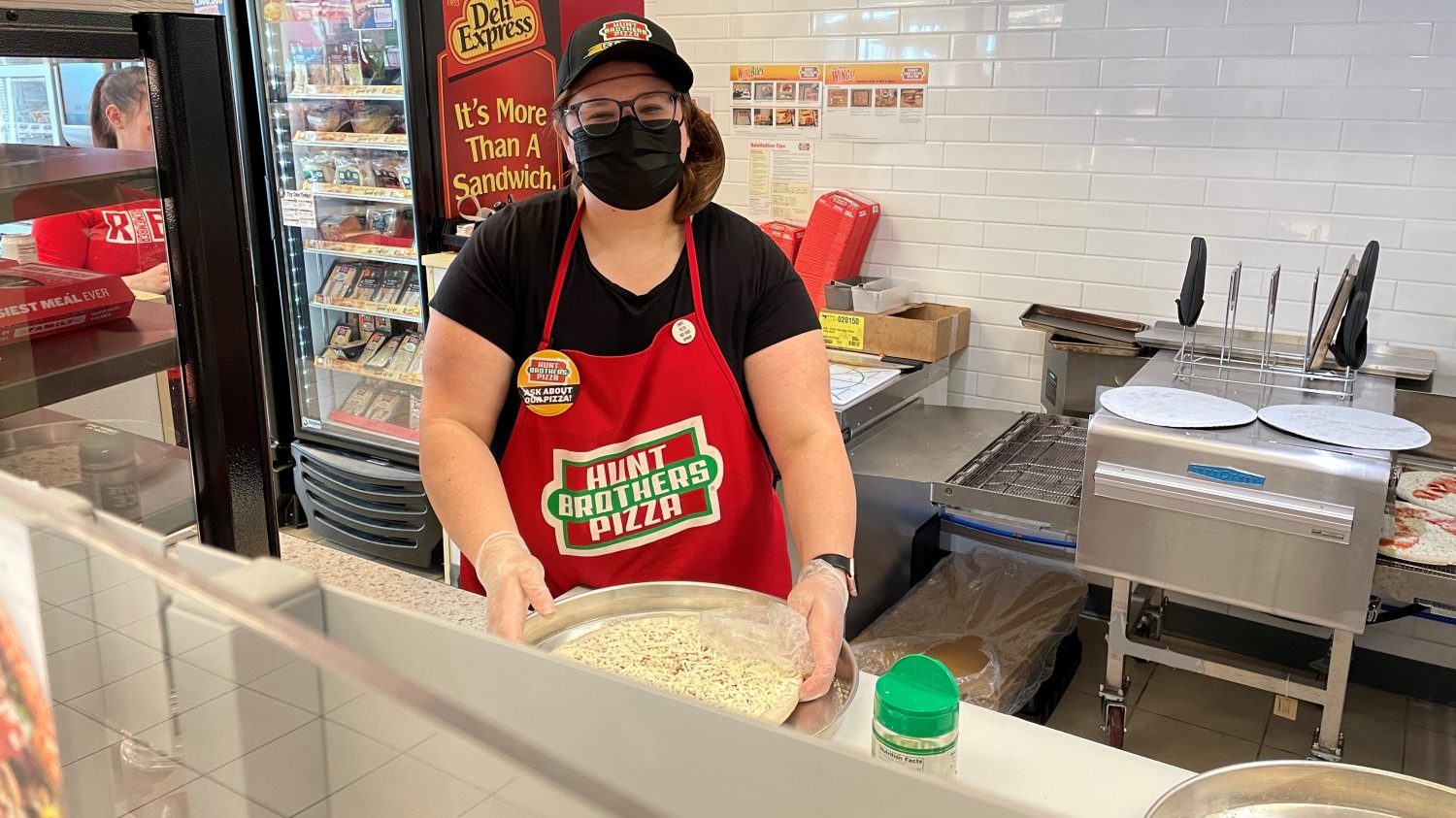 <b>Samantha Byrne, Loss Prevention manager at the Offutt Air Force Base Exchange, says she learned about Hunt Brothers Pizza safety protocols when she made pies for a pizza party at Offutt.</b>