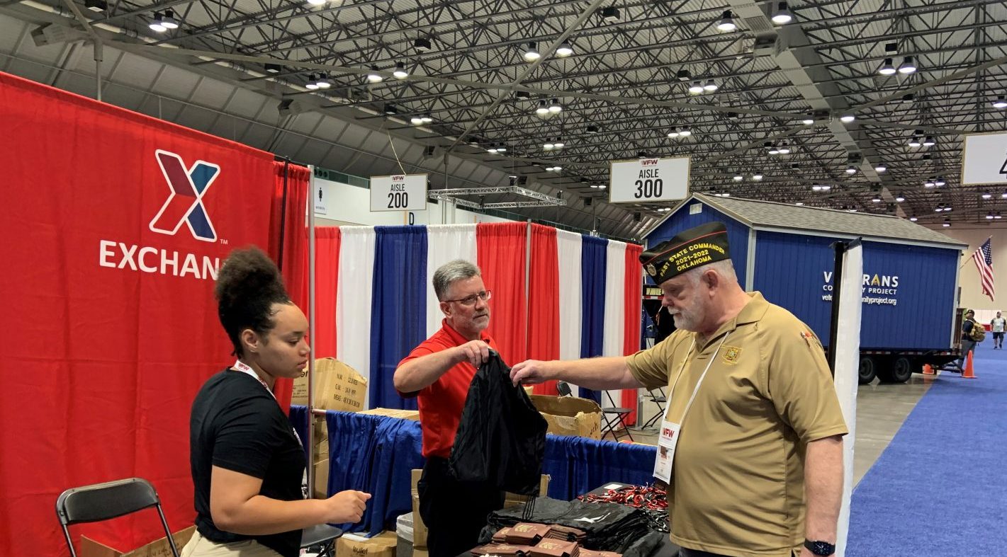 <b>Air Force SSGT Zykia N. Graham, Military Personnel Office, NCO, and 
Brian Schooley, Exchange Veteran and Military Service Organization Outreach Manager, assist a Veteran at the Exchange booth at the VFW Convention in Kansas City, Missouri.</b>
