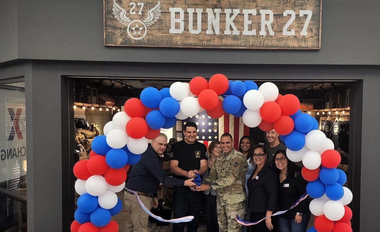 <b>From left: Exchange General Manager Donald Cantwell, Bunker 27 Owner Darren Moore, Fort Leonard Wood Command Sgt. Maj. Randolph Delapena, Exchange Services Business Manager Magaly Colon, Services Tech Nelly Alvarado, Manager Kevin Francom, Vending Assistant Maria Felix and Services Ops Rebecca Fosburgh cut the ribbon on the new offering.</b>