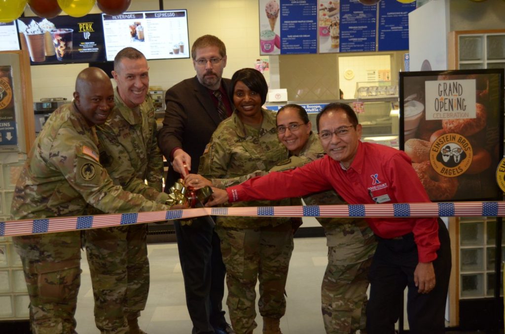 <b>The Pacific Region Command team—Col. Jason L. Beck, commander; Sgt. Maj. Generose Green, senior enlisted advisor; Lt. Col. Lanelle Pickett Jr., deputy commander; and Chief Warrant Officer 4 Leanna Lester, food safety officer—joins Okinawa General Manager David Swenson and Takaki Tokeshi, manager of the Camps Foster, Kinser and Marine Corps Air Station food courts, for the official grand opening of Einstein Bros. Bagels at the Spot Food Court on Camp Foster. The grand opening was the fourth Einstein Bros. Bagel to open in the Pacific Region with two in mainland Japan at Misawa and Yokota Air Bases and two in Okinawa, Camp Hansen and Camp Foster as the Exchange continues to provide the military community with “Better for You” dining options. (U.S. Army Photo by Staff Sgt. Mark A. Kauffman)</b>