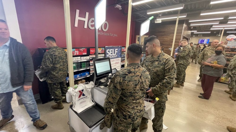 Marines try out the new self-checkout registers at the renovated Naval Air Station Joint Reserve Base Fort Worth Express.