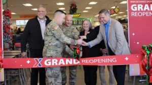 Cutting the ribbon on the Fort Rucker Exchange’s $13.5 million renovation Dec. 1 are, from left, Exchange Central Region Senior Vice President Jesse Martinez, Garrison Commander Col. Robert Holcombe, Command Sgt. Maj. Chris Doss, Exchange General Manager Brenda Hyland, Chief Administrative Officer Tom Lozier and Real Estate Vice President Michael Smietana. (Photo by Fort Rucker Exchange Visual Merchandiser Sue Antonello.)