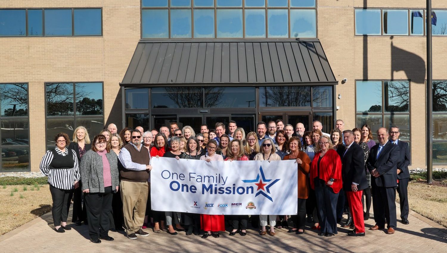 <b>Merchandising and marketing leaders from across military resale pose outside NEX HQ in Virginia Beach, Virginia.</b>