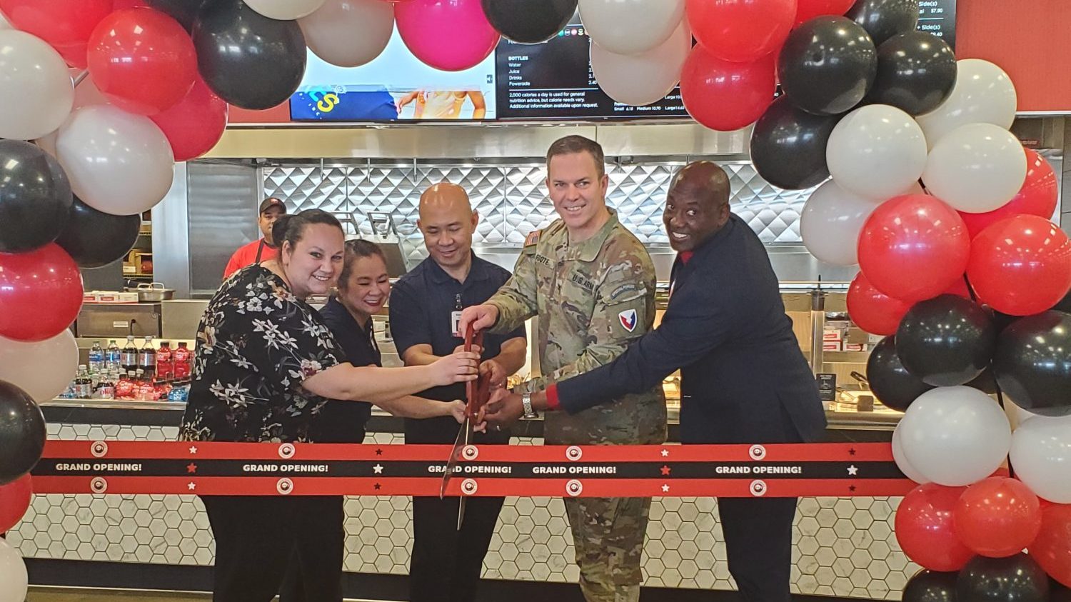 <b>From left: Exchange Services Business Manager Jessica Tacy, Panda Express Region Manager Meggie Tran, Panda Express Owner Kenny Trinh, Garrison Commander Col. Michael Foote and Exchange General Jermaine Wilson cut the ribbon on the new restaurant at Fort Riley.</b>