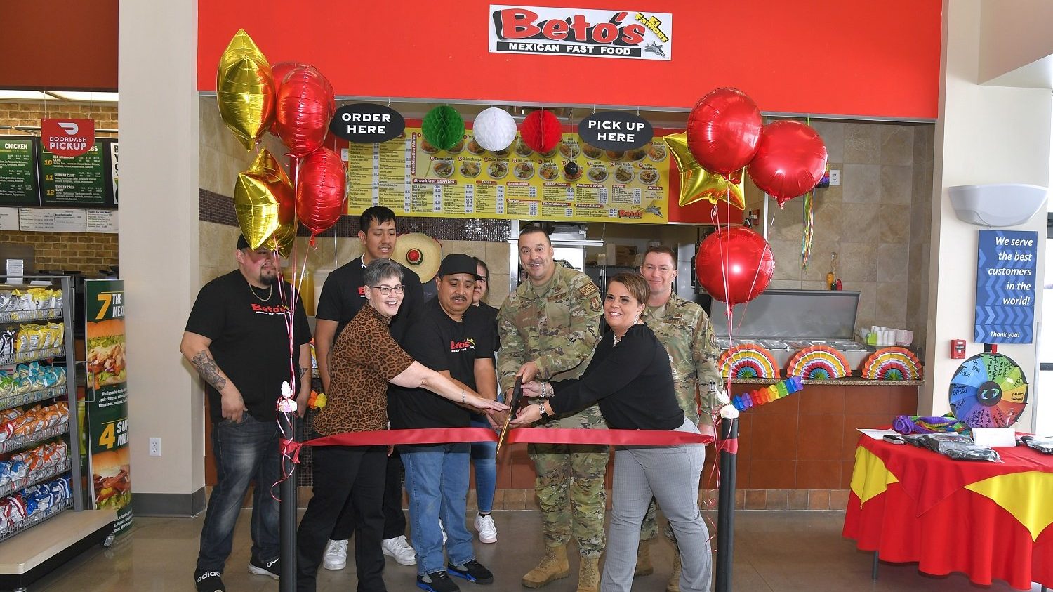 <b>Left to right, Tammy Hairston general manager Utah Exchange, Miquel
Rodriquez, owner of Beto's, Col. Khalim Taha, 75th Mission Support Group
commander, and Bianca Williams, services business manager, use ceremonial
scissors to cut the ribbon during the grand opening of Beto's Mexican
restaurant inside the AAFES Base Exchange food court March 3, 2023, at Hill
Air Force Base, Utah. Beto's Mexican restaurant is open Monday-Friday from 6
a.m.-6p.m. (U.S. Air Force photo by Todd Cromar)</b>
