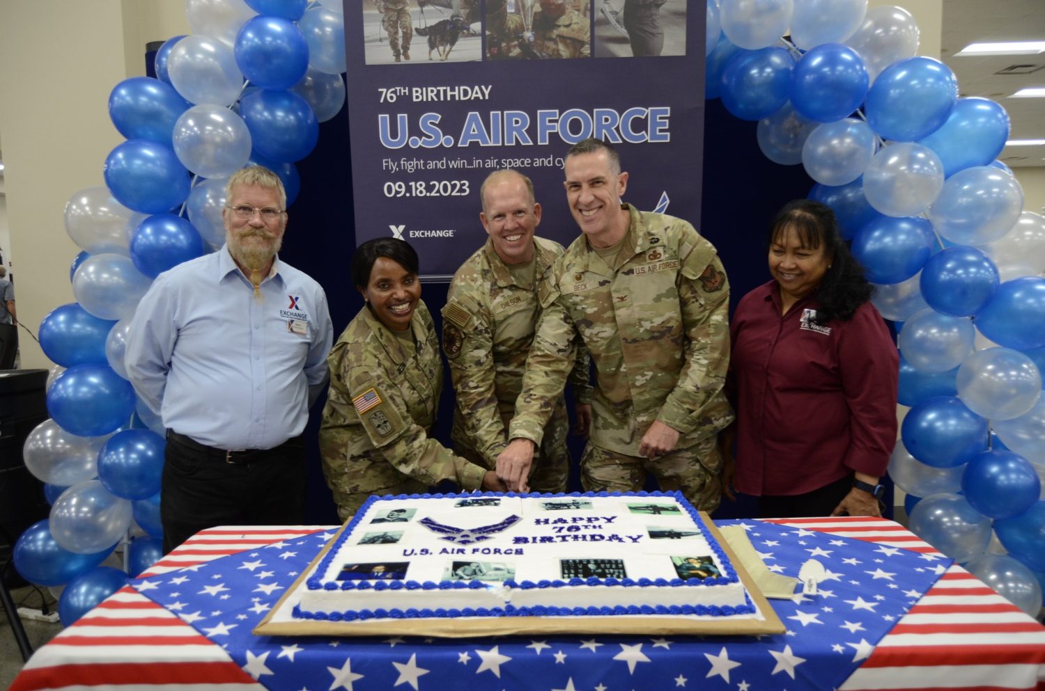 <b>From left, Mark Stopani, Kadena AB Military Clothing store manager; Army Sgt. Maj. Generose Green,  Pacific Region senior enlisted advisor; Lt. Col. Gregg Chilson, 18th Mission Support Group deputy commander; Air Force Col. Jason L. Beck, Exchange Pacific Region Commander; and Flordeliza “Flor” Payton, Kadena store manager, cut a cake celebrating the Air Force’s 76th Birthday.</b>