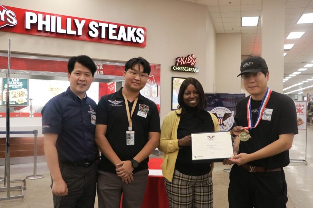 >b>Osan Food Court Manager Song, Song-in, 51st FSS Outdoor Recreation Lead Specialist David Kwon, Camp Humphreys and Osan AB General Manager Vanessa Rowland and Yi, Tong-hun posts for a picture after Yi was awarded Presidential Volunteer Service Award signed by the 46th U.S. President, Joe Biden and a Bronze Medal for his volunteerism. After one year of volunteering, Yi completed more than 100 hours of behind-the-scenes coordination and support which ensured Airmen could enjoy their outdoor activities and resulted in him receiving the PVSA. (Courtesy Photo by Humphreys Exchange)</b>
