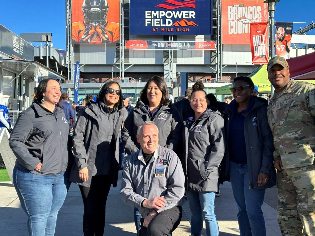 <b>Air Force Chief Master Sgt. Kevin "KO" Osby, the Exchange's senior enlisted advisor, with Exchange teammates at the Army-Air Force football game in Denver. From left, back row: Aniushka Lugo Ramos, Sarimar Vega, Gina Janoushek, Breanna Boettcher, Daryl McCormick and Osby.
Front: Michael Casserly.</b>