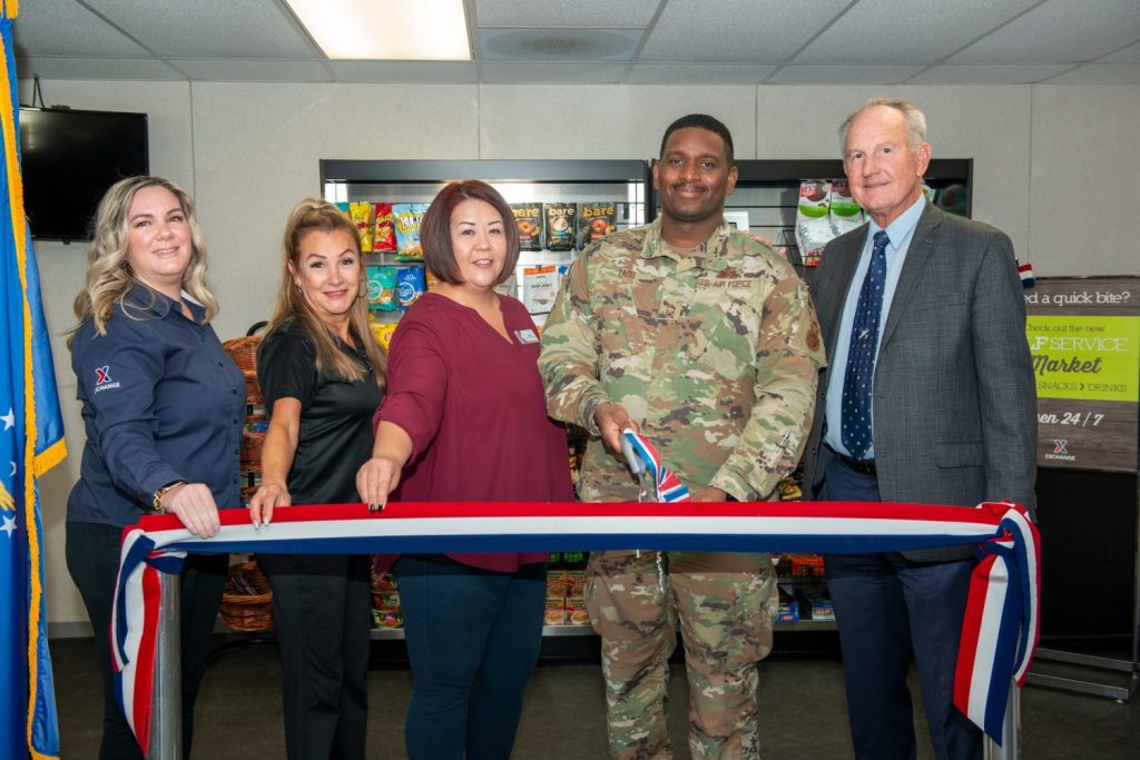 <b>Preparing to cut the ribbon on the unmanned retail market at are, from left, Edwards BX General Manager Courtney Escobedo, Star Vending Manager Sandy Wiebort, Services Business Manager Tiffany Duque, Senior Enlisted Leader Senior Master Sgt. Eric Tabb, Plant Director Dr. David Smith