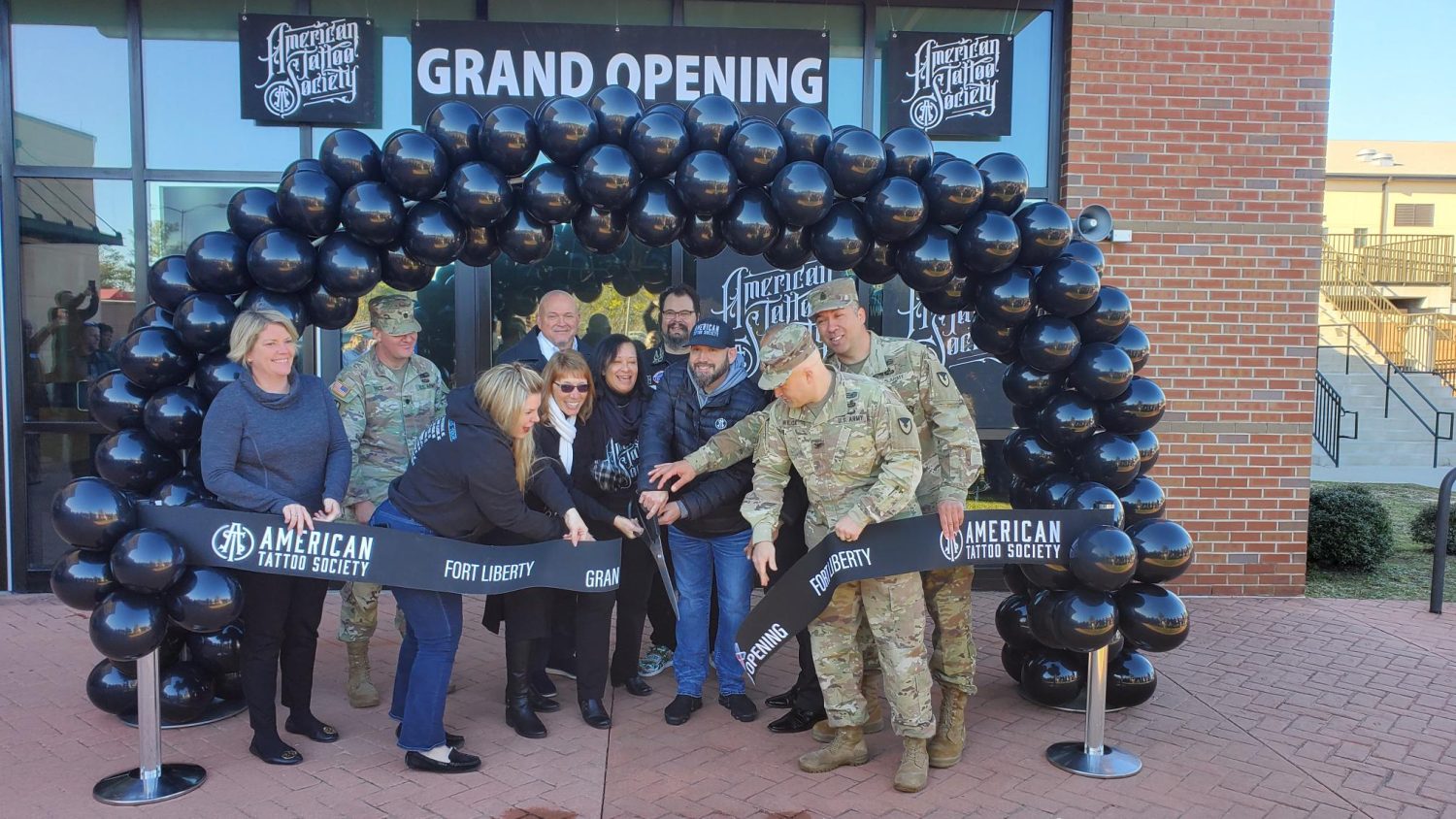 <b>At the ribbon-cutting for Fort Liberty's new American Tattoo Society studio, from left: Jennifer Hudges        Deputy MWR Director
LTC Owen Price         Chief for Environmental Health,  Fort Liberty
Chris Holifield           RVP 
Nicole Harrell            Wife/ Owner ATS
Alex Dewberry           GM admin
Cheryl Chevis           SBM
Ryan Harrell             ATS Owner
Thomas “TK” Kuttamperoor       GM
COL John Wilcox              GC
CSM Gregory Seymour          Garrison CSM

