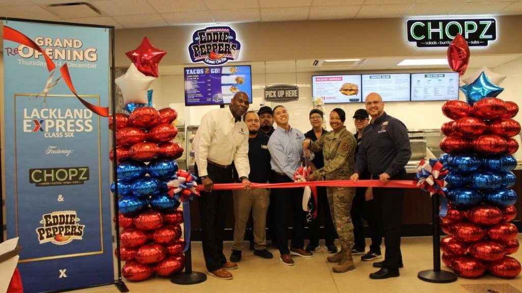 <b>Chopz, a quick serve restaurant, opened at Lackland AFB Express on Dec. 14. From left: Exchange Regional Vice President Antonio Porter; Lackland AFB Store Manager Kris Cubacub; 502nd Installation Support Group Commander Col. Shamekia Toliver; and General Manager Mikel Hunter. In back: Express store associates.</b>