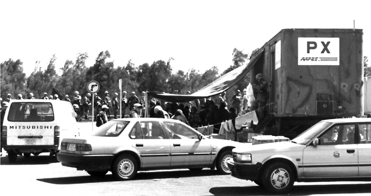 <b>American troops line up at a mobile field Exchange set up in Kuwait during Operation Desert Shield/Storm.</b>