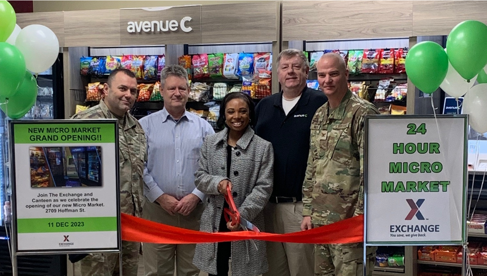 <b>Truax Air Field Command and Exchange leaders cut the ribbon on the new market located inside the former Exchange mall. From left: Chief Master Sgt. Alvarez, Everett, Catlett, Canteen Coordinator Michael Milski and Col. Guy.</b>