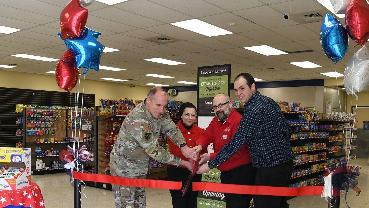 Leadership cut the ribbon on the full-size unattended retail market at the grand opening event. From left: Wing Commander Col. Daniel Kramer; Exchange Services Business Manager Doaa Hassan; General Manager Charles Thrasher; and The Snack Guys LLC President Bryan Grasso Shonka. 