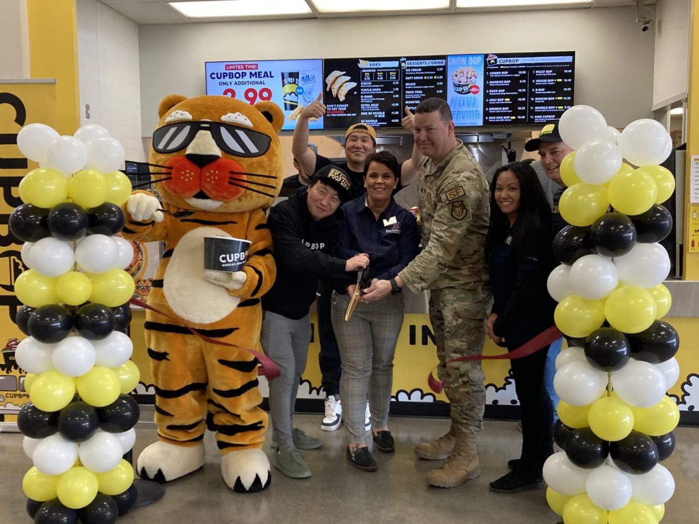 <b>From left: Dok Kwon, Cupbop chief operating officer; Junghun Song, Cupbop chief executive officer; Bianca Williams, Exchange services business manager; Lt. Col. Cameron Maher, 75th Security Forces commander; Eleanor Veloria, Exchange main store manager; Mike Penn, Cupbop vice president.</b>