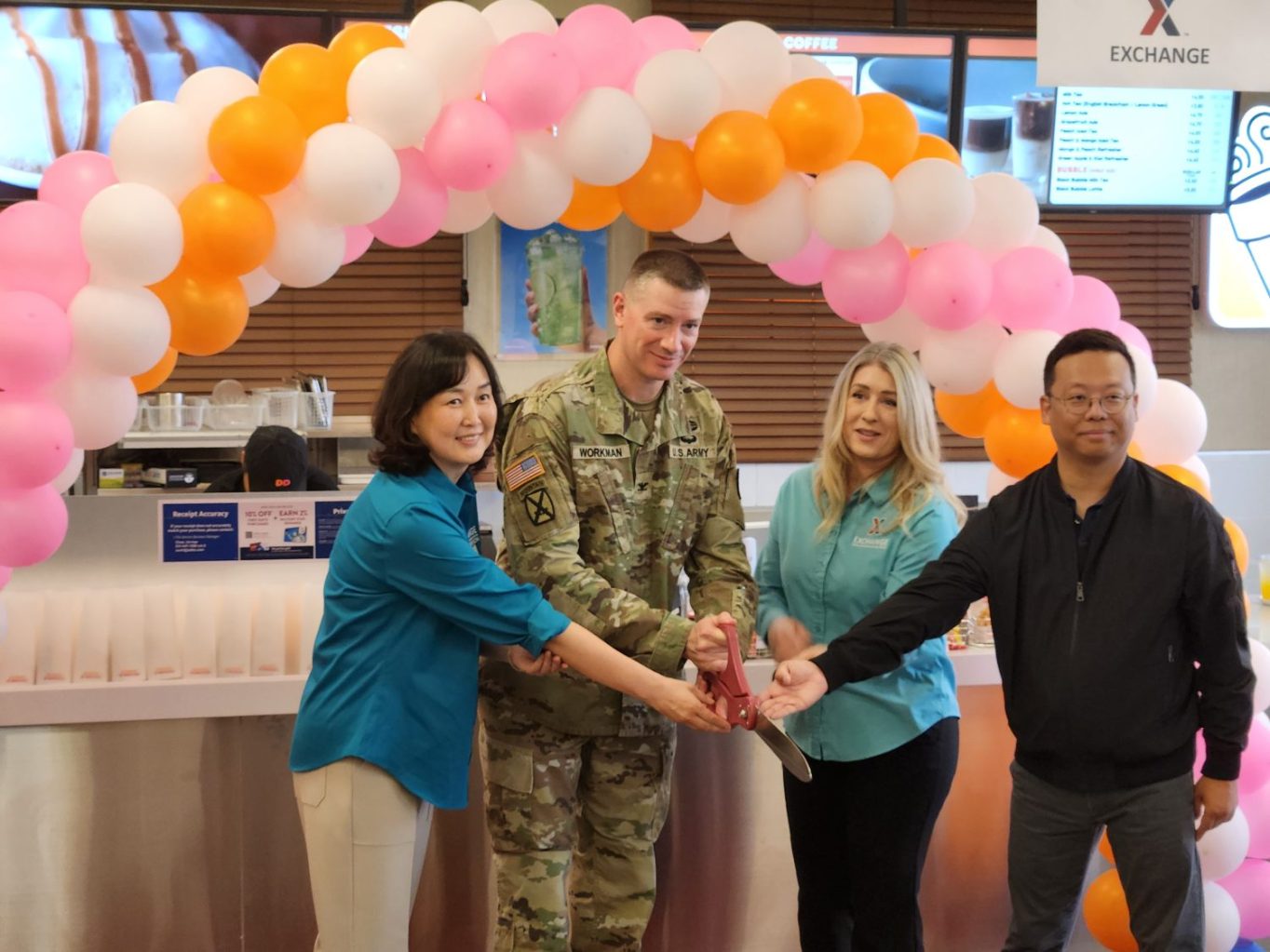 <b>From left: Camp Humphreys Exchange Service Business Manager Choe, Un-hye, Garrison Commander Col. Ryan Workman, Main Store Manager Tonya Jones and Dunkin’ owner Yang, Kyong-sok cut the ribbon on the relocated Dunkin’ on May 21.</b>