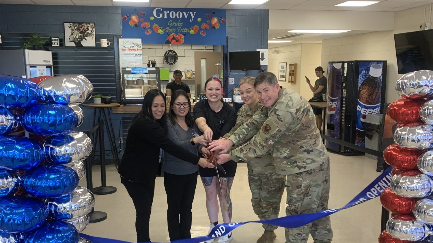 <b>Maria Rivera, Exchange services business manager; Joanne Bedford, Exchange general manager; Josie Frizzell, owner; Jessica Baldwin, 27th Special Operations Wing chief; Col. Barry Roche, 27th Special Operations Wing commander.</b>