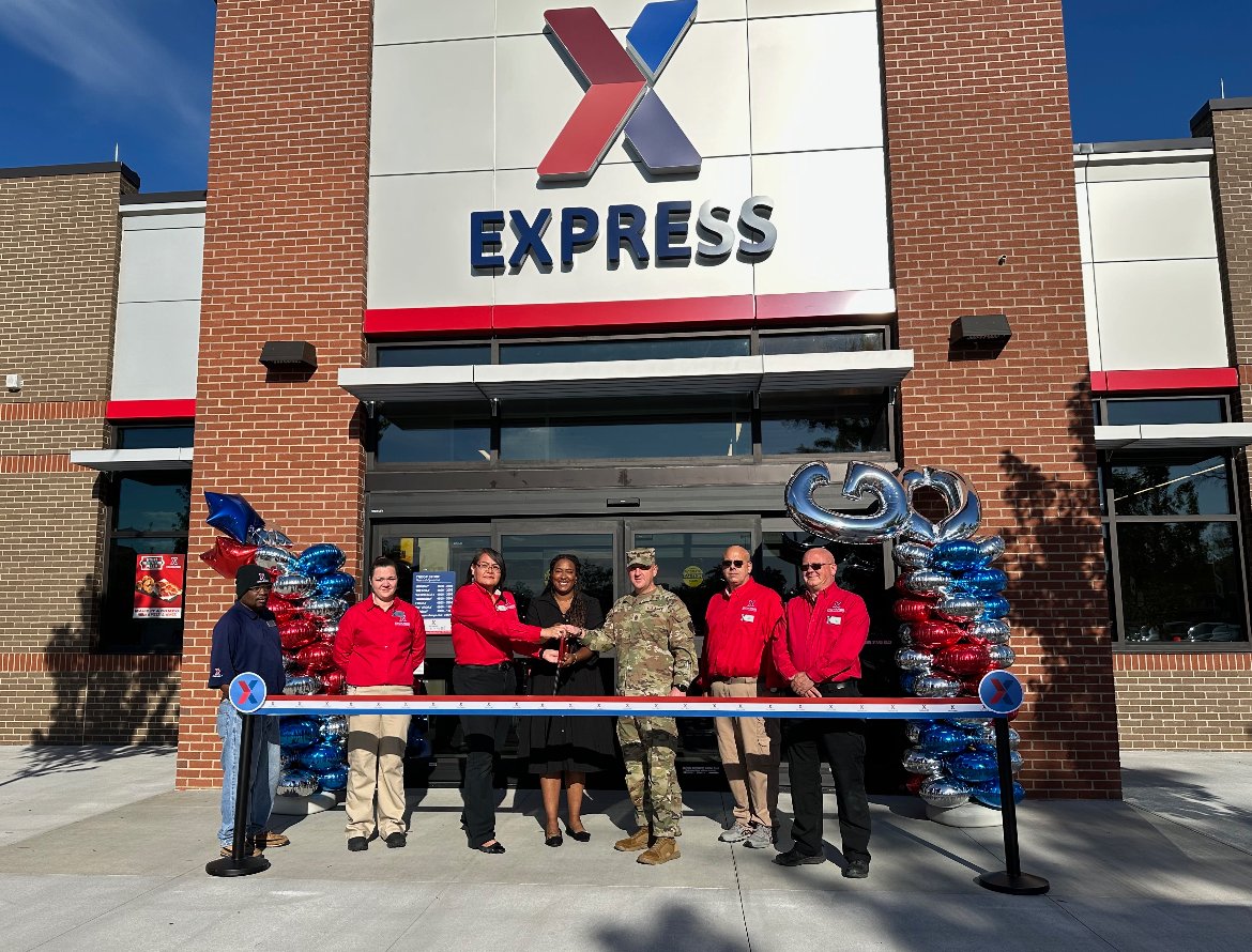 <b>From left: Customer Experience Associate Clifton “Maurice” Waller, Shift Manager Jessie Sweet, Store Manager Dava Maestas, Fort Eisenhower Exchange General Manager LaToya Harris, Fort Eisenhower Garrison Command Sgt. Maj. Daniel Durette, Assistant Store Manager Christopher Cerasaro, and Shift Manager Paul Trocki cut the ribbon on the new troop store in Fort Eisenhower, Georgia.</b>