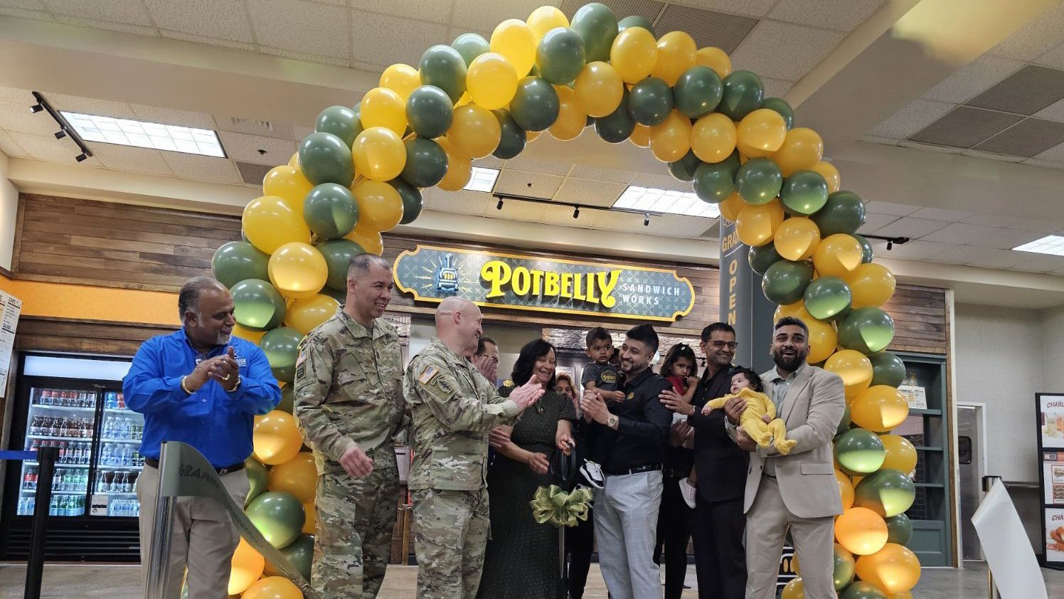 Photo ID: From left, Thomas Kuttamperoor, Exchange general manager, Command Sergeant Major Greg Seymour, Col. John Wilcox, garrison commander, Cheryl Chevis, Exchange business services manager, Andy Rice, Potbelly vice president of operation services, Shak Patel and Sugar Madhiwala, franchisee partners.</b> 