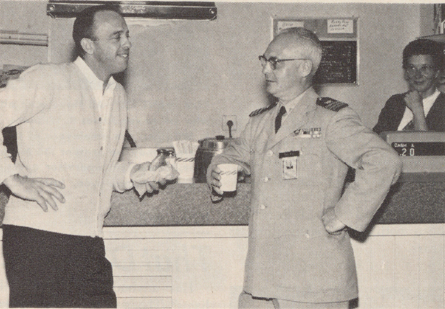 Astronaut Alan Shepard, the first American in space, visits with two associates at the Vandenberg Air Force Base Exchange in 1962.